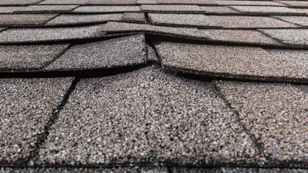 Asphalt shingles that are warped with spaces between tiles introduces leaks.